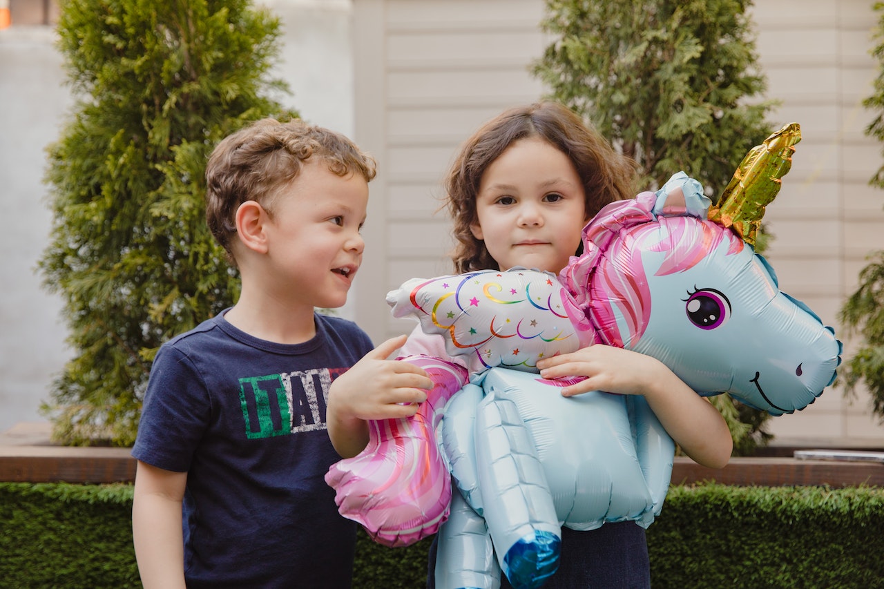 Kids with unicorn toy